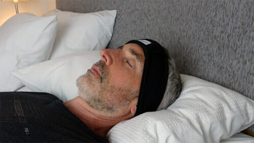man using sleep headphones