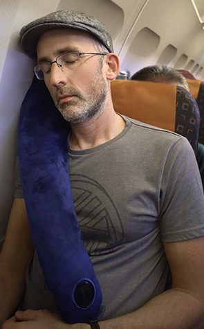 man using the Travelrest pillow