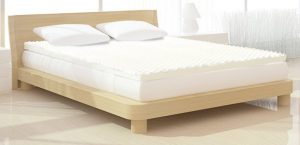 a mattress topper on a bed