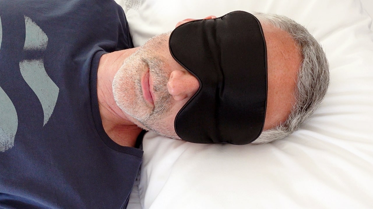 man wearing the Alaska Bear sleep mask