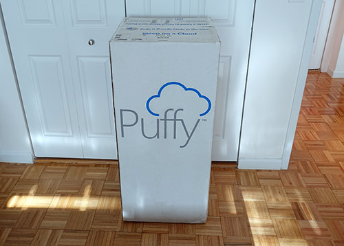 The Puffy Lux mattress in the original box