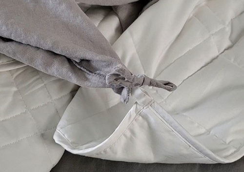 photo of the a weighted blanket insert tied to the cover