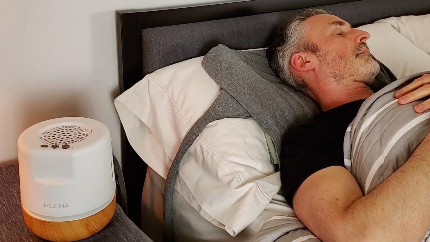 man sleeping with the Moona cooling pillow pad