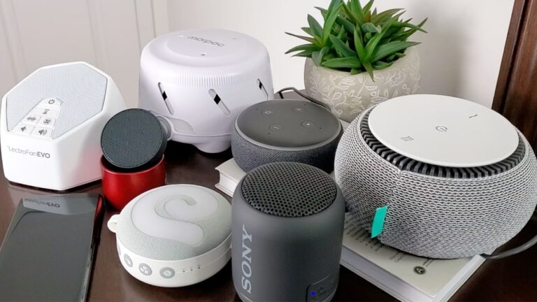 white noise machines, a phone and bluetooth speakers