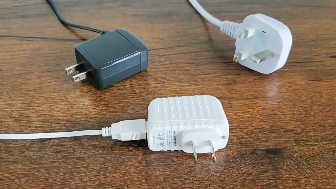 three examples of white noise machine plugs and cables