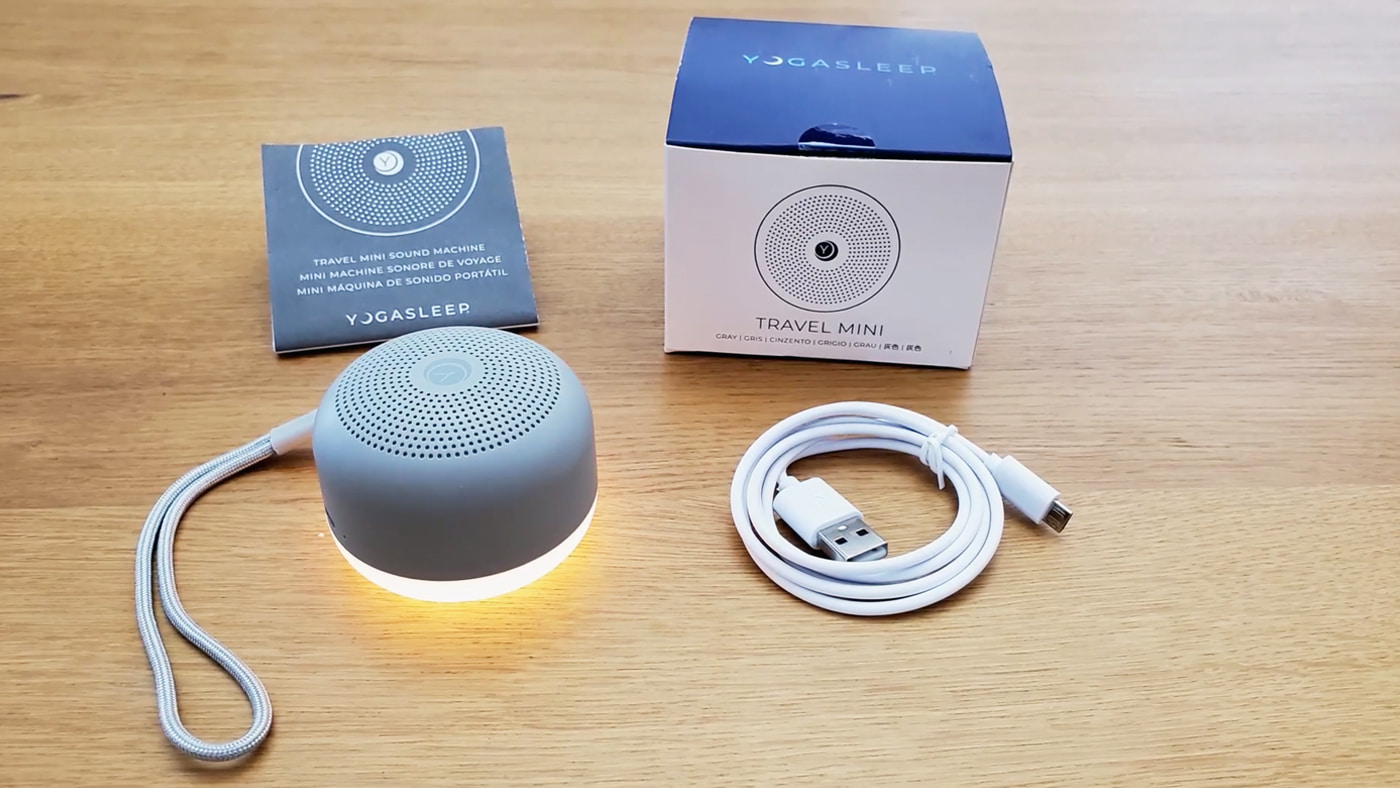 Yogasleep Travel Mini white noise machine with the box, cable, and manual