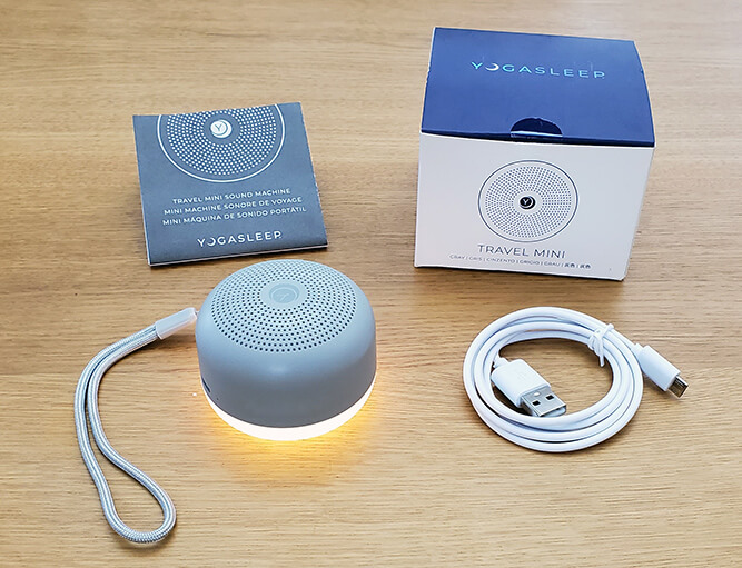 yogasleep travel mini white noise machine with the box, charging cable, and instruction manual