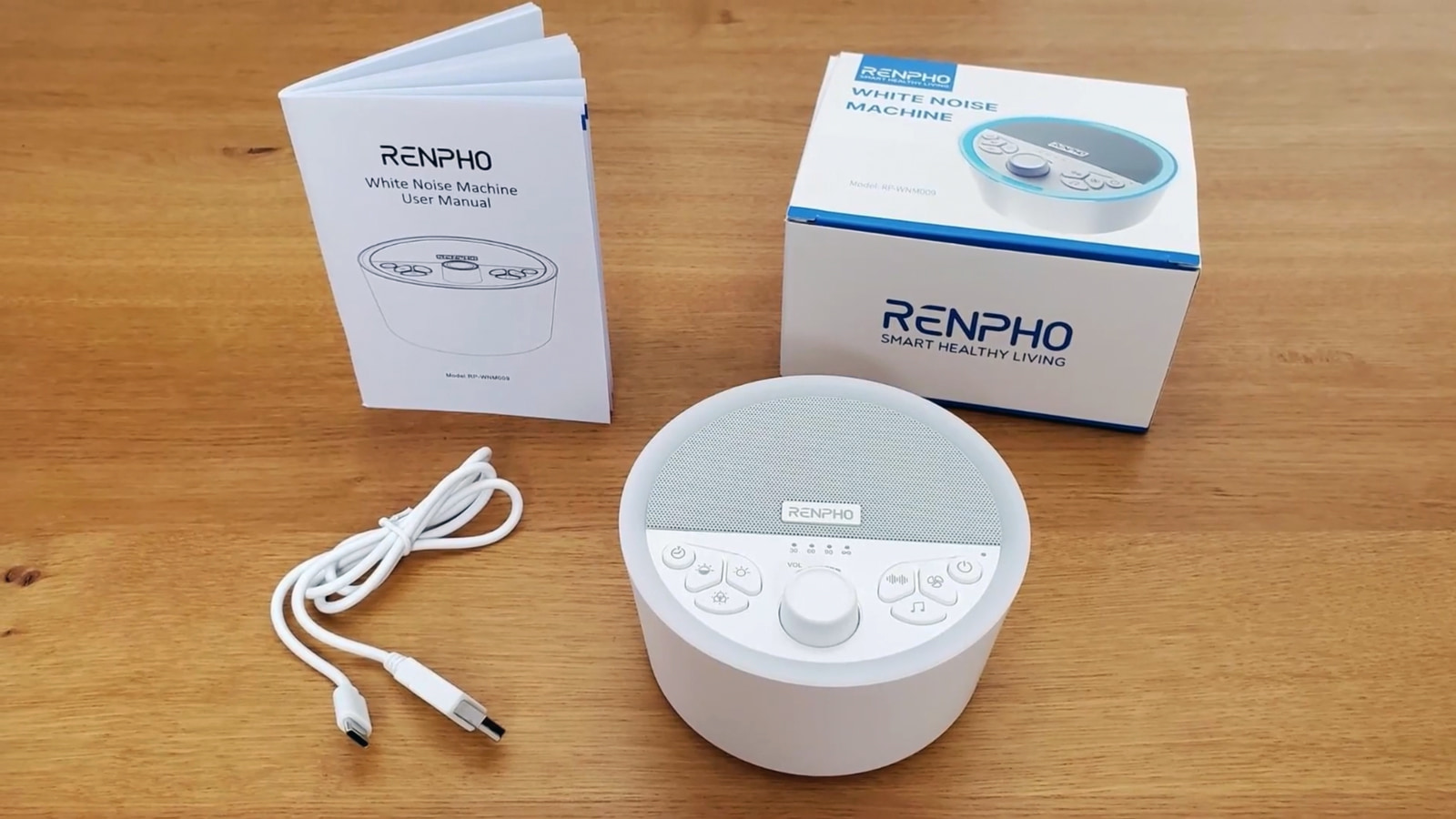 Renpho white noise machine, the charging cable, box and user manual.