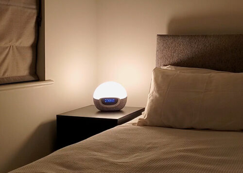 lumie bodyclock on a nightstand in the bedroom