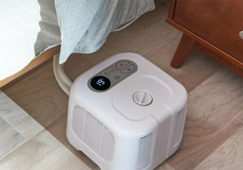 original chili cube sleep system next to a bed