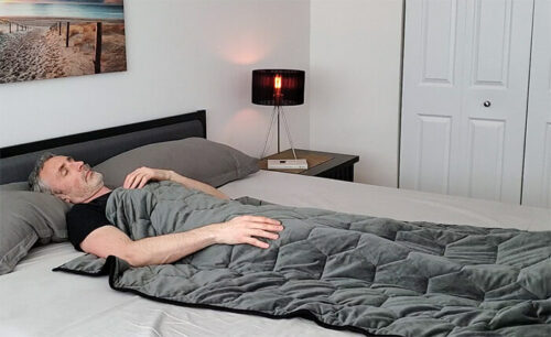 man using the layla weighted blanket 