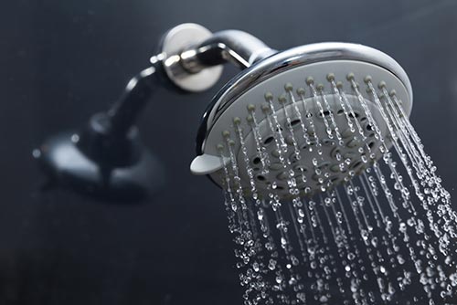 photo of water flowing from a shower head