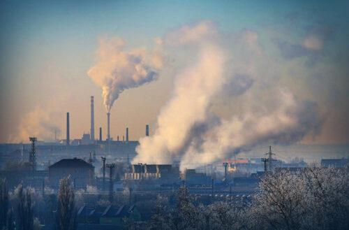 photo of a power plant producing polluting emissions