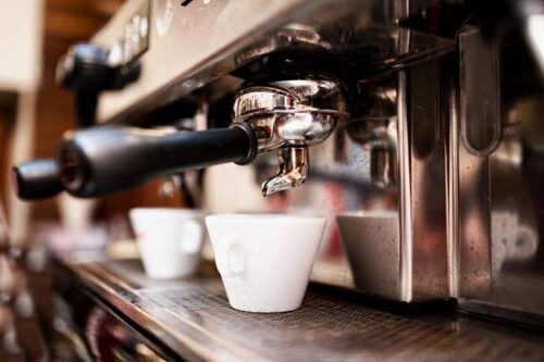 photo of a coffee machine making a coffee