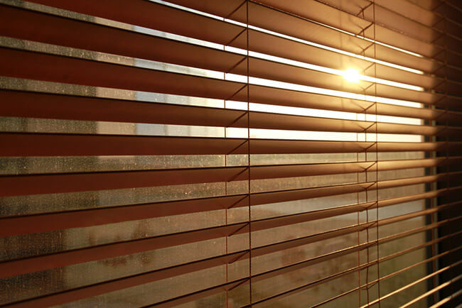 photo of blinds with sunlight coming through