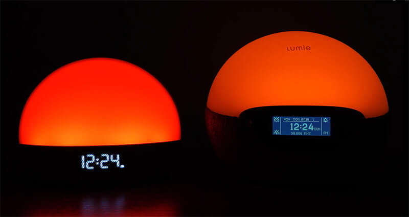 photo of the hatch restore and lumie bodyclock shine 300 side by side with red lights on