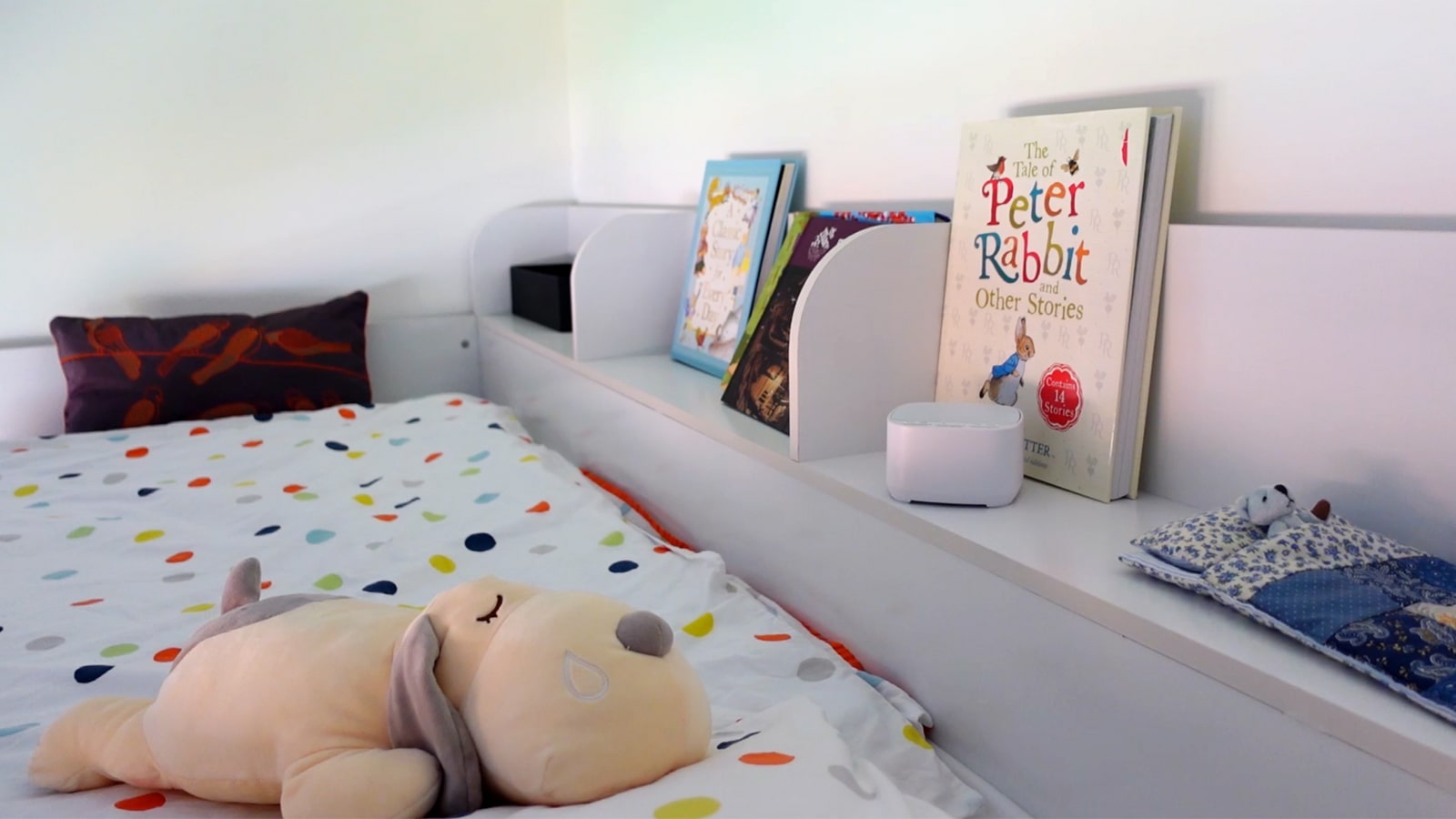 Magicteam white noise machine on a shelf in a kid's room