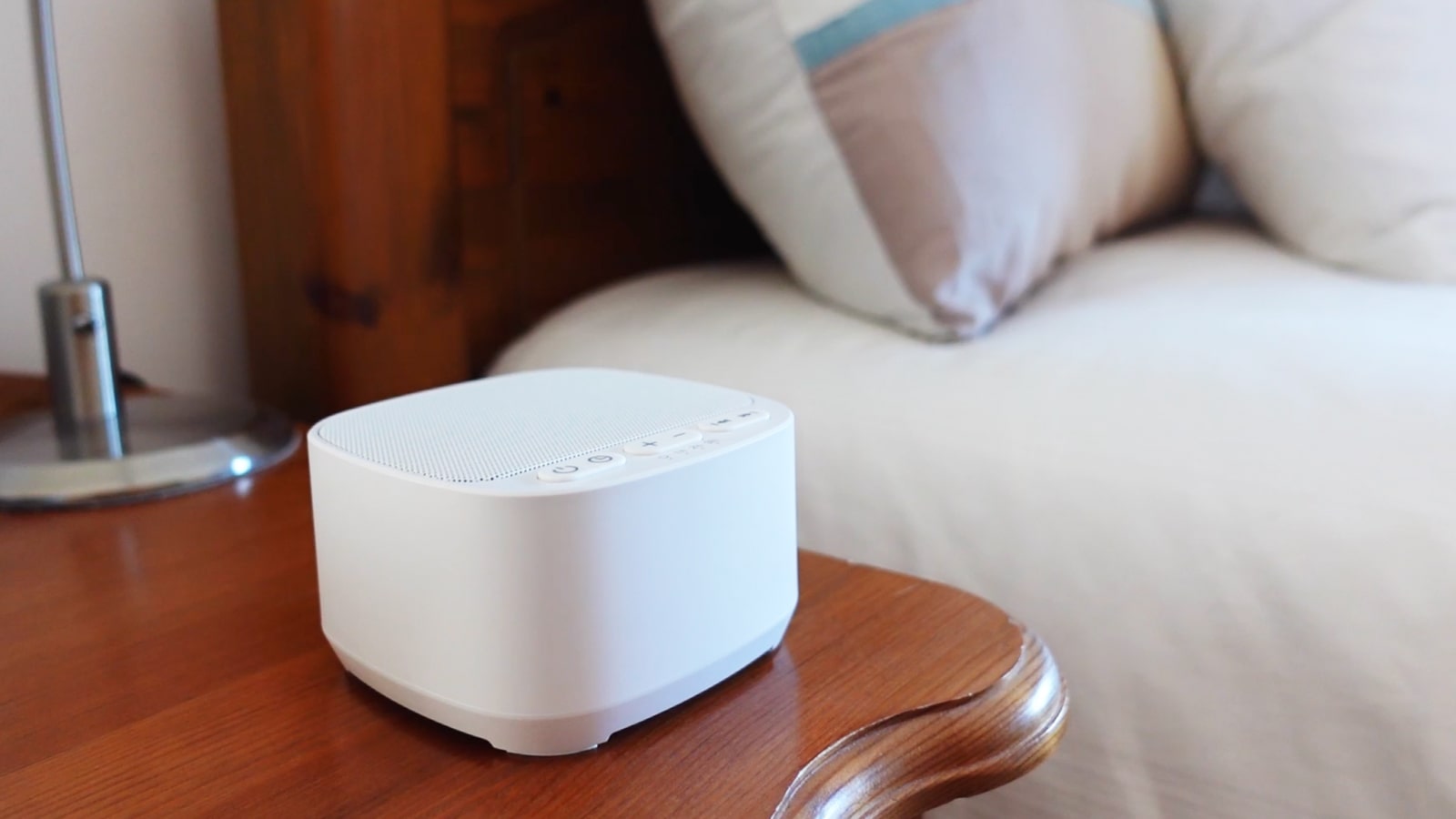 magicteam sound machine on a nightstand in a bedroom 