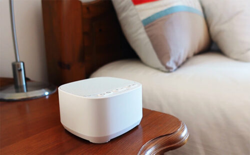magicteam sound machine on a nightstand in a bedroom 