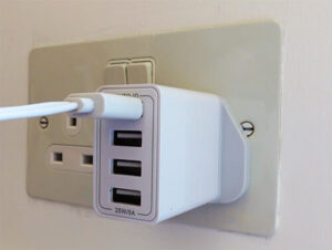magicteam usb cable plugged into a 5 volt power adaptor in a wall socket