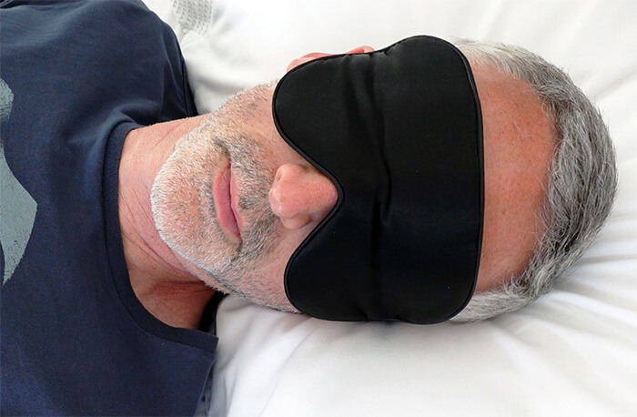 photo of a man wearing the Alaska Bear sleep mask