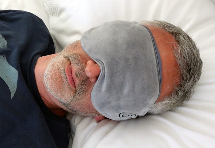 Man using the Barmy weighted sleep mask