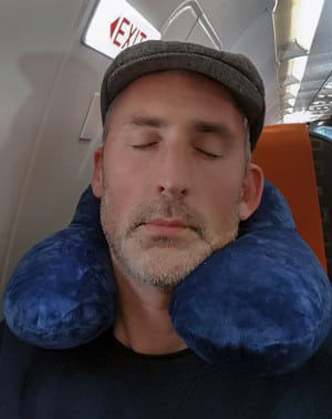 mvloc inflatable neck pillow on a plane