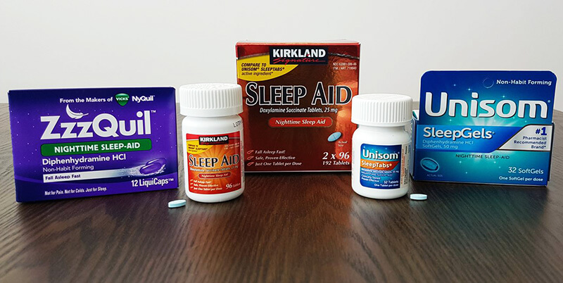 photo of Zzzquil Nighttime, Kirland Signature sleep aid, Unisom Sleeptabs and Unisom sleepgels on a table.