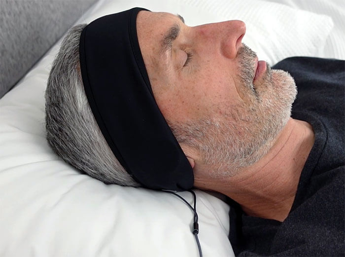 photo of a man using the Cozyphones while asleep