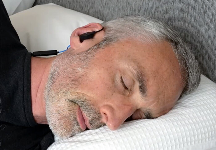 man wearing Dubs Labs Bedphones while sleeping