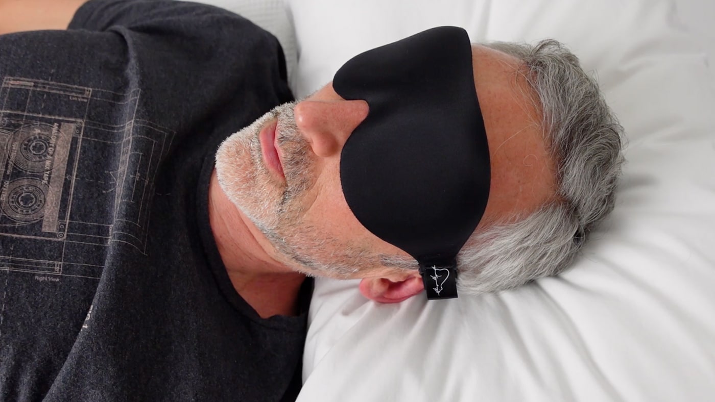 man wearing the contoured Alaska Bear sleep mask