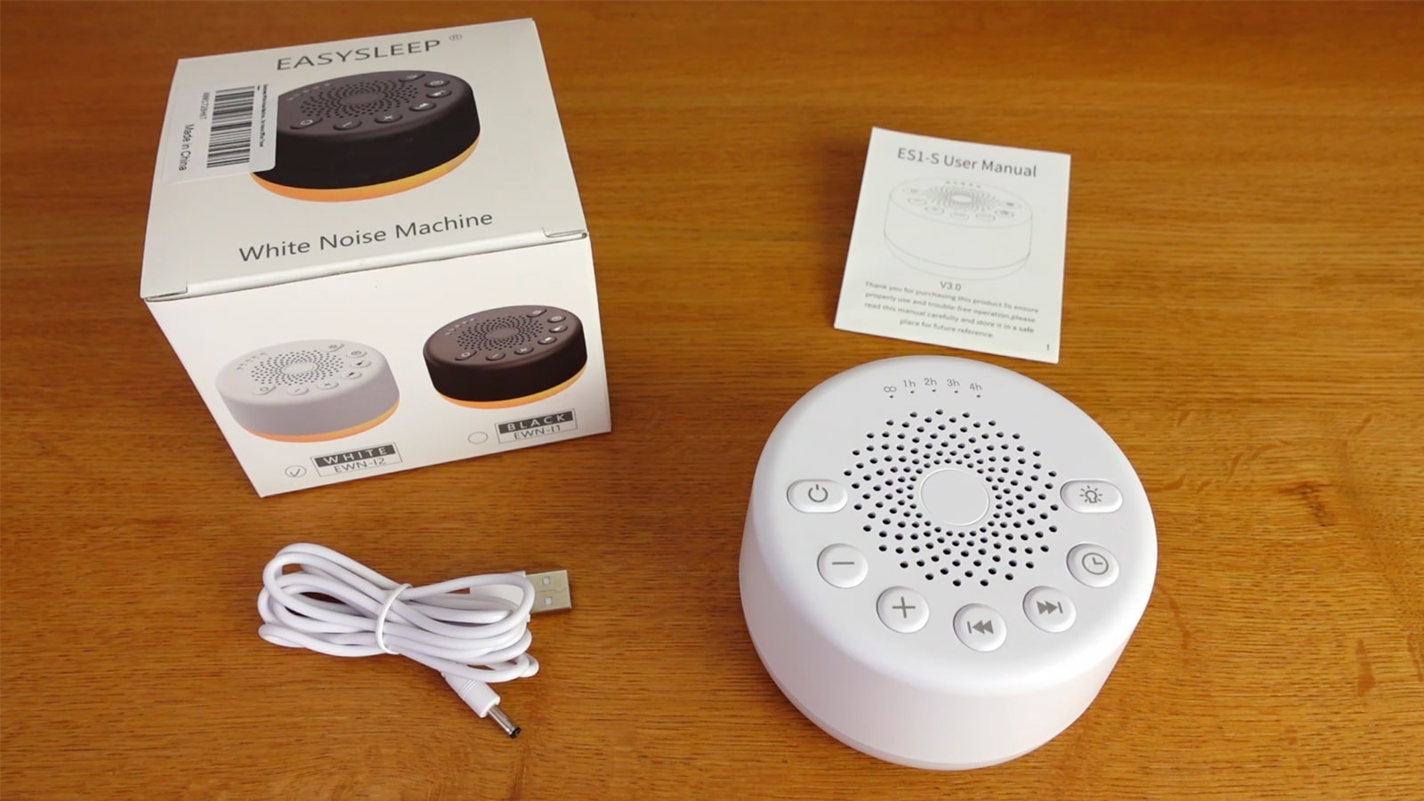 photo of the Easysleep sound machine, the box, power cable, and user manual