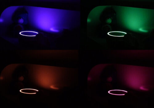 photo of a range of Yogasleep Dreamcenter nightlight settings: blue, green, orange and pink