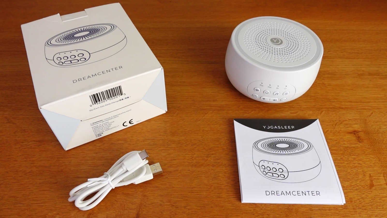 photo of the Yogasleep Dreamcenter, the box, manual, and cable