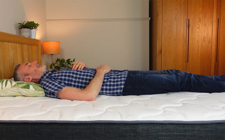 man lying on his back on the Inofia hybrid mattress