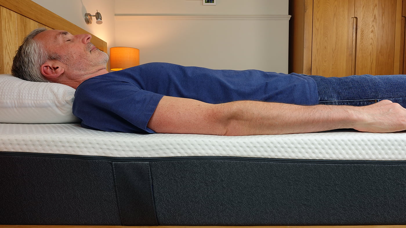 man lying on the Emma Original mattress 18 months later