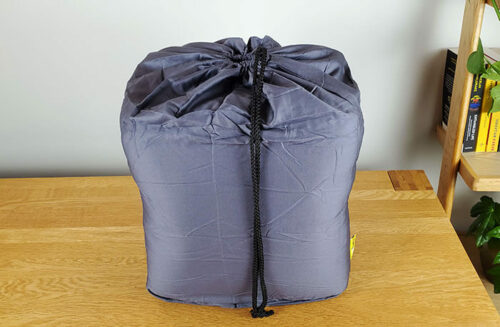 photo of the Cosi Home weighted blanket in a drawstring carry bag