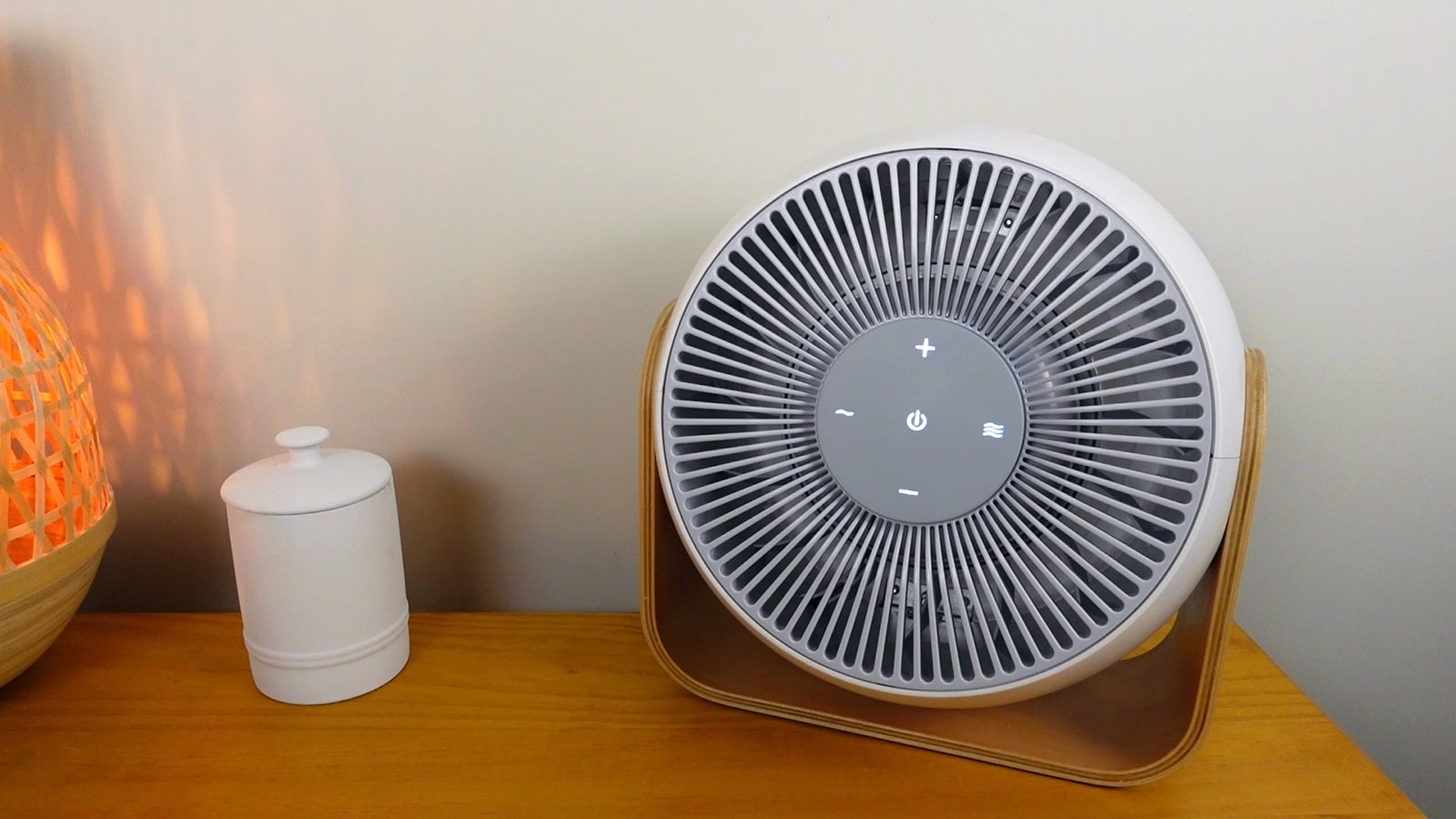 SNOOZ Breez white noise machine on a table in a bedroom
