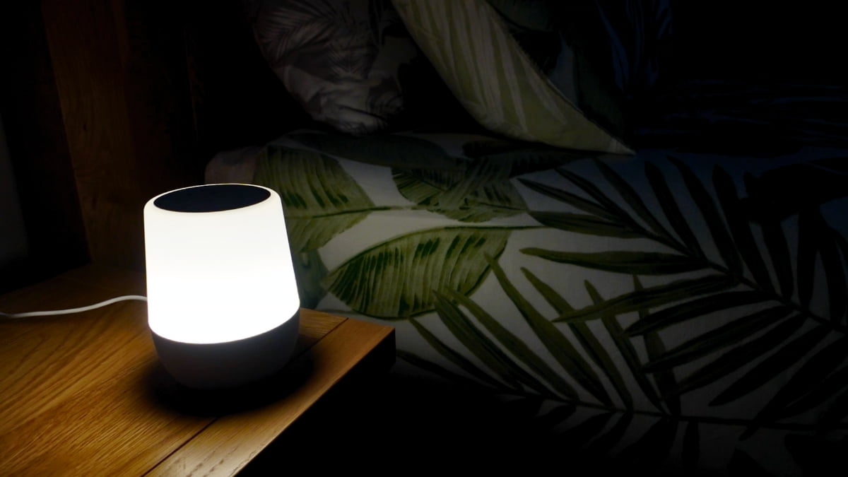 Yogasleep Duet nightlight on in a dark bedroom