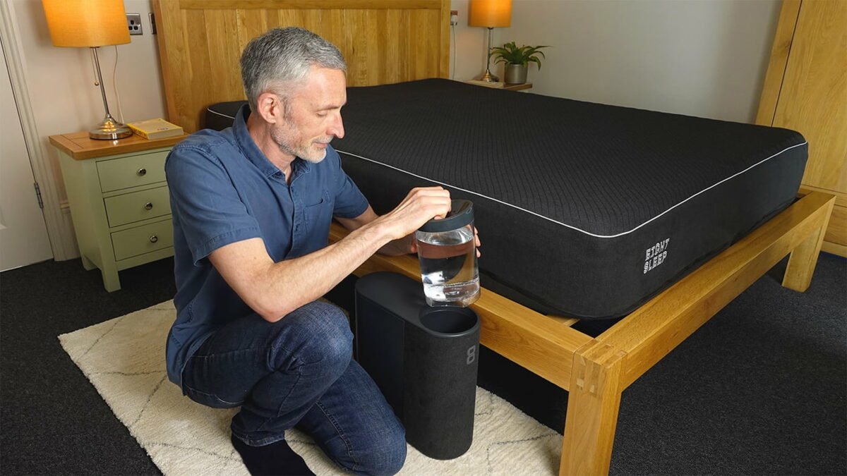 Man setting up the Eight Sleep Pod 3 Cover