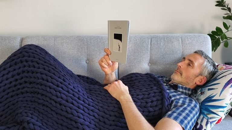 man using the Bearaby Napper weighted blanket
