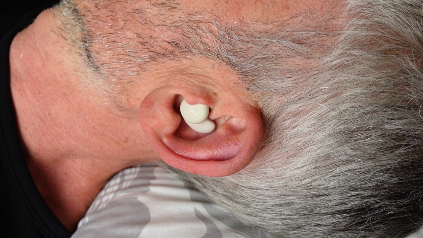 man wearing soundcore sleep a20 in left ear