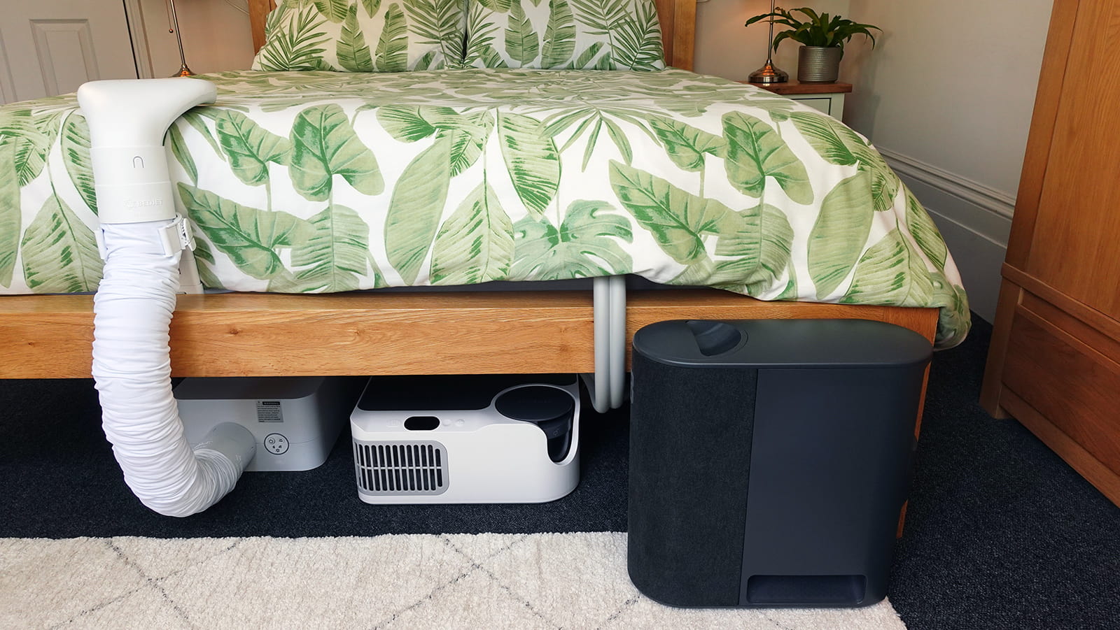 photo of the Chilipad Dock Pro, Eight Sleep Pod 3, and BedJet 3 control units side by side.