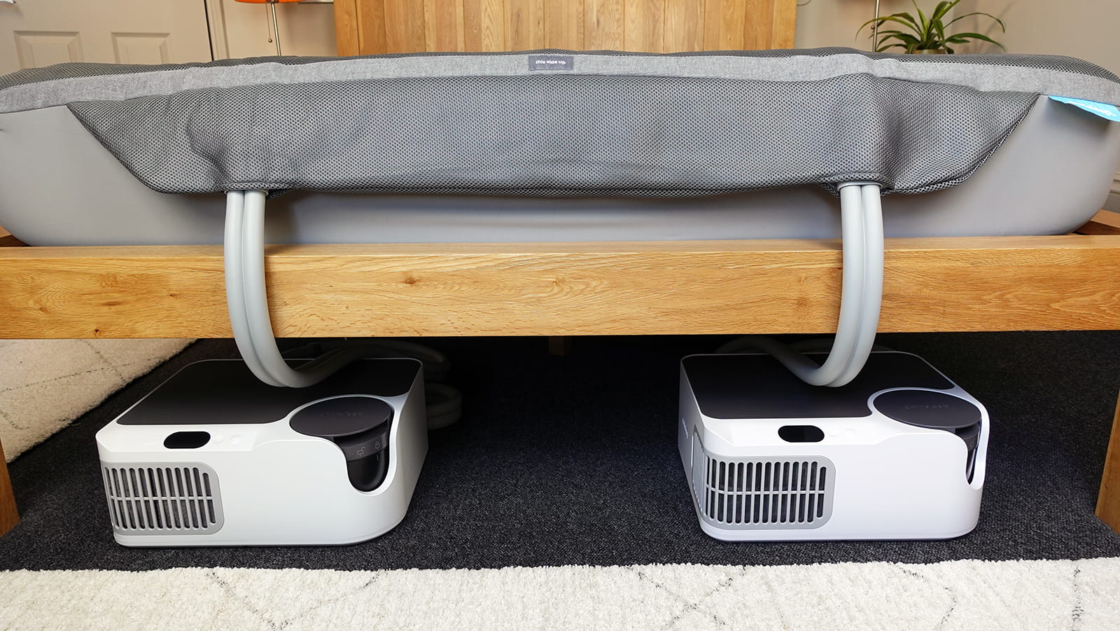 SleepMe Chilipad Dock Pro bed cooling and heating system set up in a bedroom