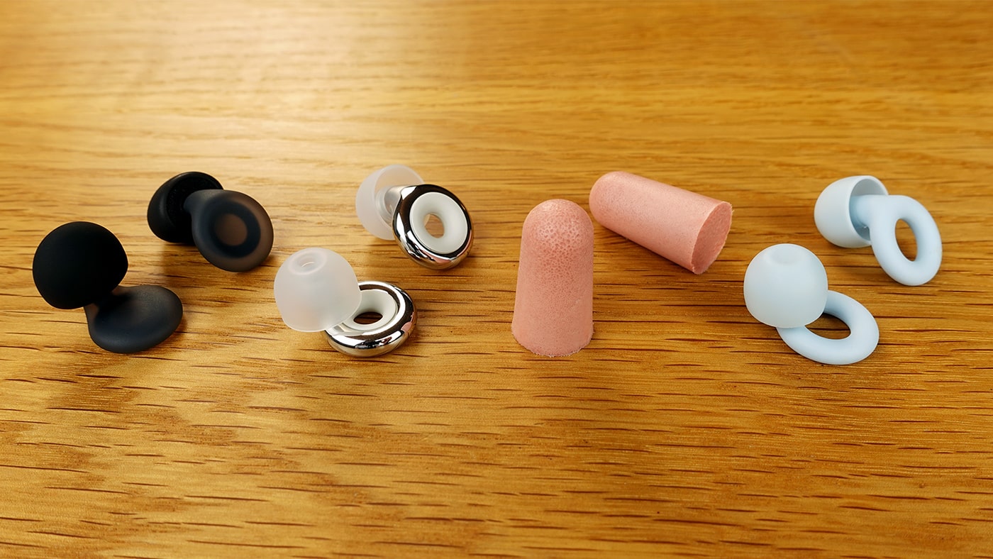 Loop Experience 2 Plus, Loop Dream, Loop Quiet 2, and Mack's Ultrasoft earplugs close up on a table