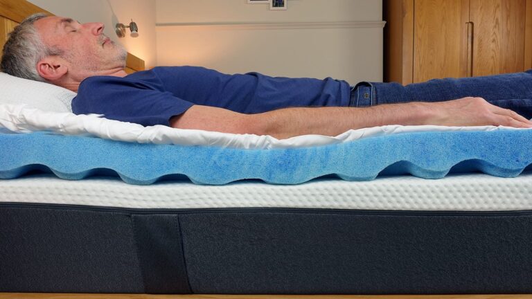 man sleeping on a mattress topper