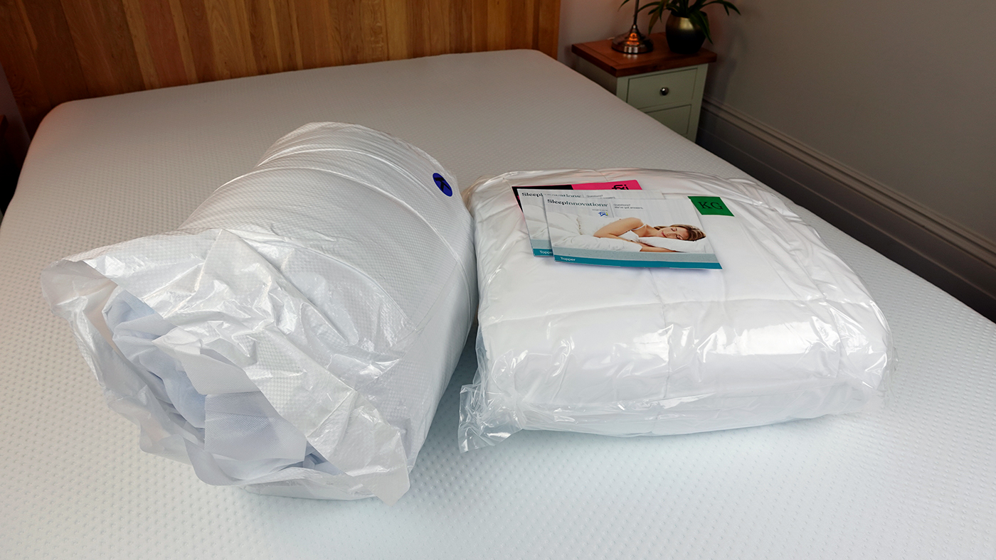 Sleep Innovations mattress topper in original packaging