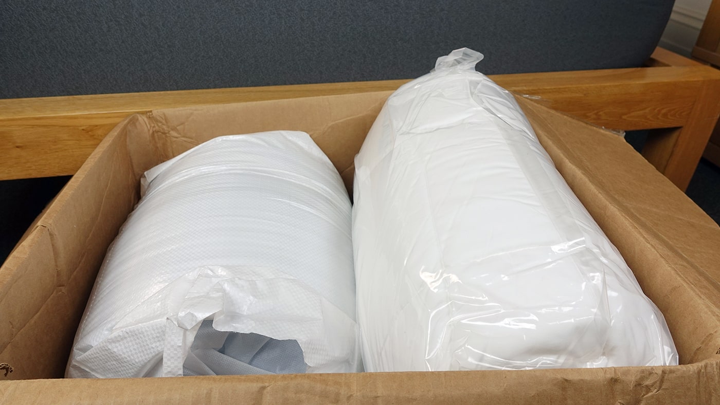 Sleep Innovations mattress topper inside delivery box