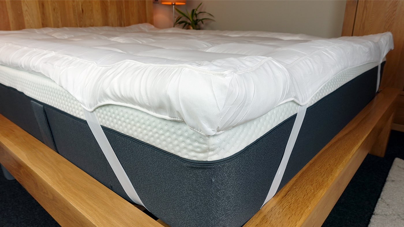 close up photo of the MightySoft mattress topper corner strap