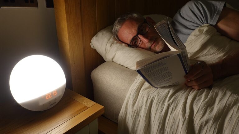 man reading in bed